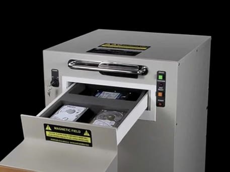 A machine that is open to reveal papers.