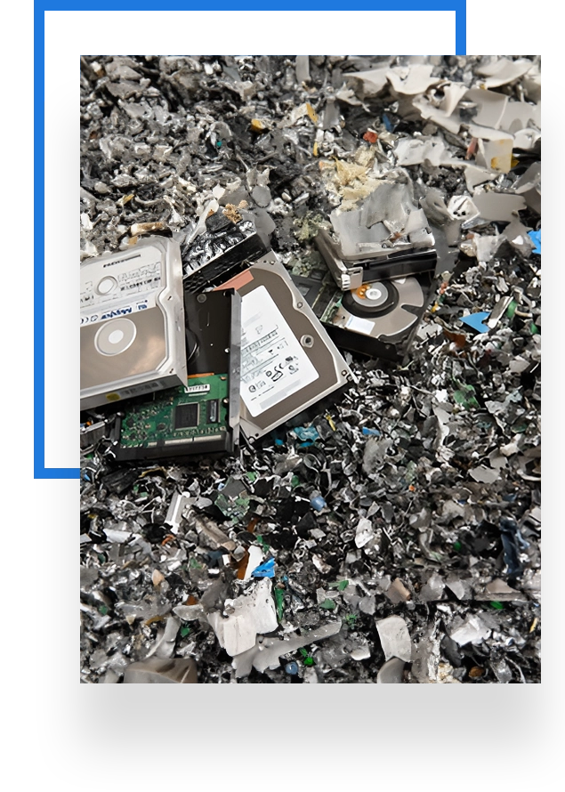 A pile of broken up computer parts on the ground.